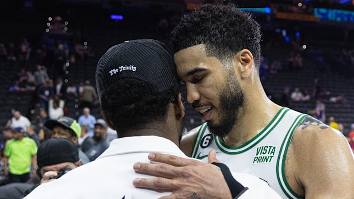 May 11, 2023; Philadelphia, Pennsylvania, USA; Boston Celtics forward Jayson Tatum (0) talks with Cleveland Cavalier Donovan Mitchell after a victory against the Philadelphia 76ers in game six of the 2023 NBA playoffs at Wells Fargo Center. Mandatory Credit: Bill Streicher-Imagn Images