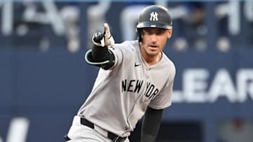 Jul 22, 2025; Toronto, Ontario, CAN;   New York Yankees left fielder Cody Bellinger (35) reacts after hitting a double against the Toronto Blue Jays in the third inning at Rogers Centre. Mandatory Credit: Dan Hamilton-Imagn Images
