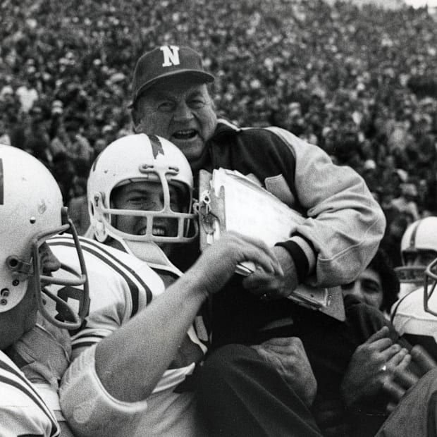 Nebraska head coach Bob Devaney is carried off the field after the Huskers' 35-31 victory at Oklahoma in 1971.