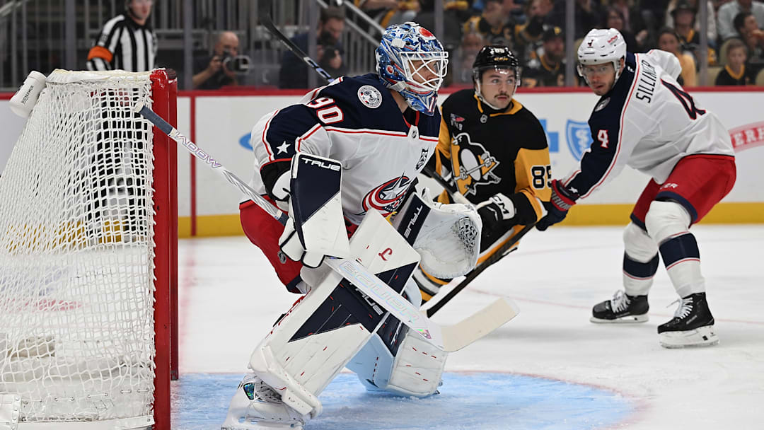 Blue Jackets goaltender Elvis Merzlikins faces the play against the Pittsburgh Penguins Blue Jackets goaltender Elvis Merzlikins faces the play against the Pittsburgh Penguins