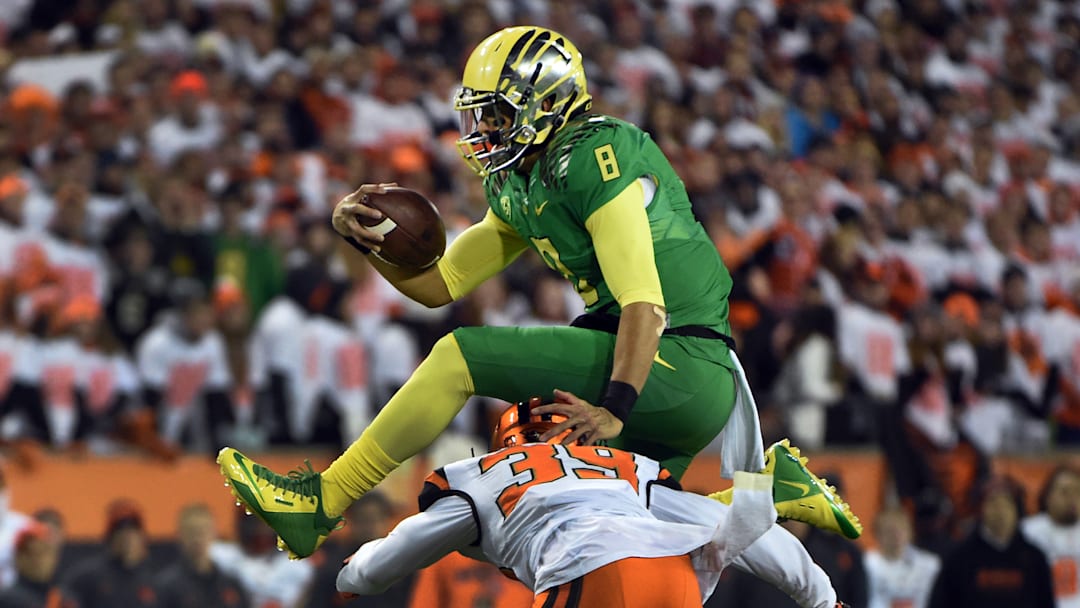 Marcus Mariota hurdles Justin Strong, Oregon vs. Oregon State