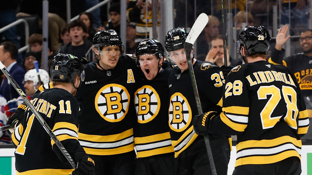 (Left to Right) Casey Mittelstadt, Hampus Lindholm, Henri Jokiharju, Morgan Geekie, and Elias Lindholm celebrate a goal