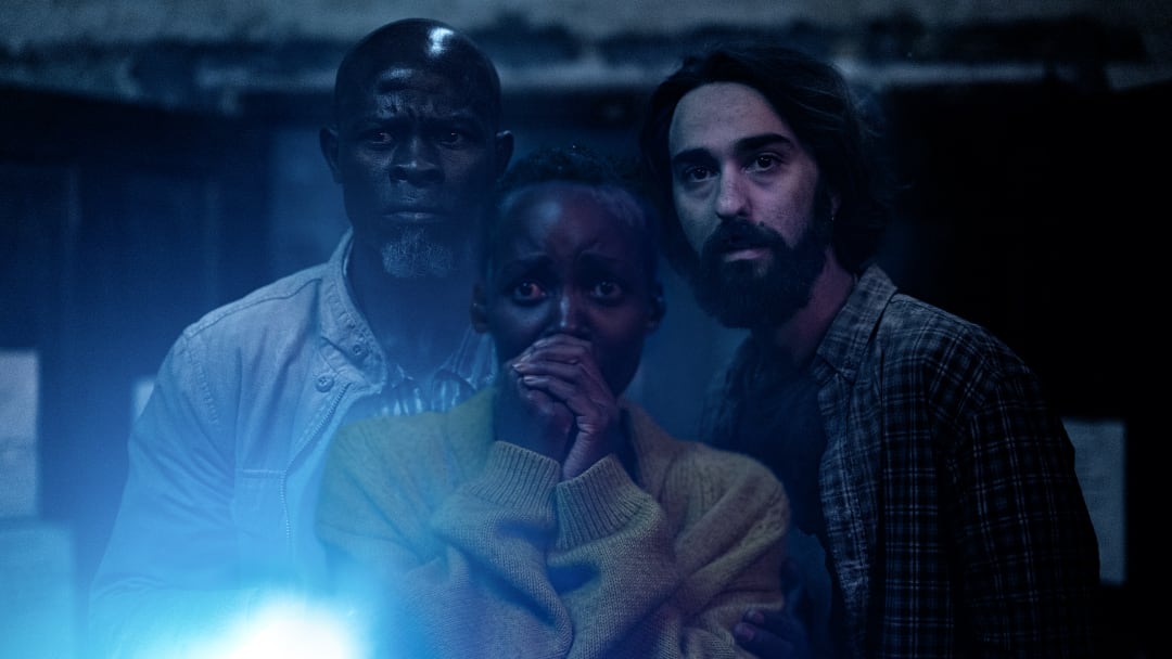 Djimon Hounsou as “Henri”, Lupita Nyong’o as “Samira” and Alex Wolff as “Reuben” in A Quiet Place: Day One from Paramount Pictures.