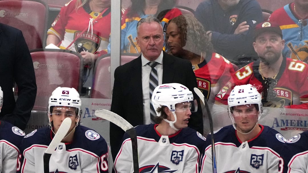 Dec 6, 2025; Sunrise, Florida, USA;  Columbus Blue Jackets head coach Dean Evason keeps an eye on his team during the third period against the Florida Panthers at Amerant Bank Arena. Mandatory Credit: Jim Rassol-Imagn Images