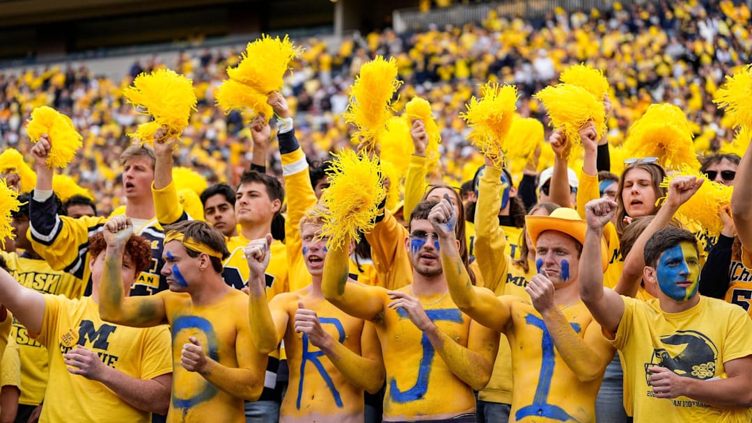 Sep 7, 2024; Ann Arbor, Michigan, USA; Michigan fans cheer for the Wolverines against Texas during the first half at Michigan Stadium. Mandatory Credit: Junfu Han-USA TODAY Network via Imagn Images