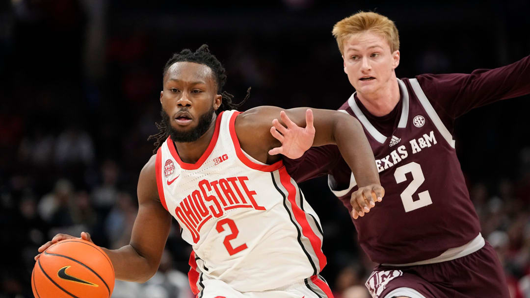 Nov 10, 2023; Columbus, Ohio, USA; Ohio State Buckeyes guard Bruce Thornton (2) dribbles past Texas A&M Aggies guard Hayden Hefner (2) during the first half of the NCAA basketball game at Value City Arena.