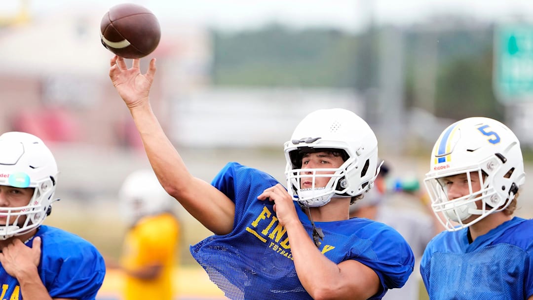 Aug 4, 2022; Findlay, OH, USA; Findlay quarterback Ryan Montgomery looks to throw the ball during practice at Findlay High School on August 4, 2022. Ryan's brother Luke is an offensive linemen committed to Ohio State.

Ceb Osufb Montgomery Kwr 08