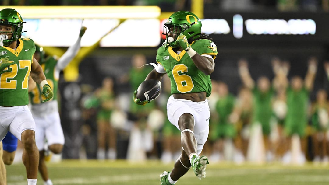 Sep 7, 2024; Eugene, Oregon, USA; Oregon Ducks running back Noah Whittington (6) scores a touchdown during the second half against the Boise State Broncos at Autzen Stadium. Mandatory Credit: Troy Wayrynen-Imagn Images