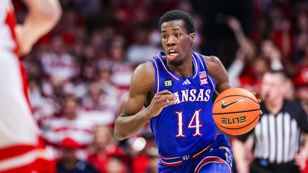 Feb 28, 2026; Tucson, Arizona, USA; Kansas Jayhawks guard Melvin Council Jr. (14) dribbles the ball during the first half of the game against the Arizona Wildcats at McKale Memorial Center. Mandatory Credit: Aryanna Frank-Imagn Images