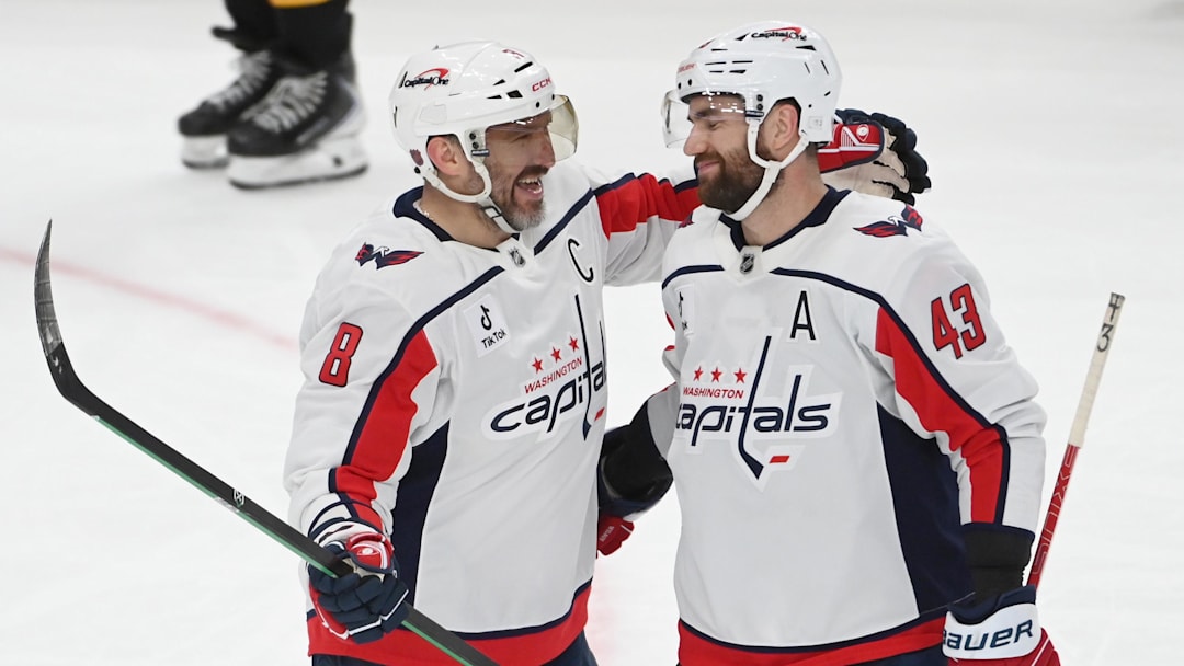 Apr 11, 2026; Pittsburgh, Pennsylvania, USA;  Washington Capitals left wing Alex Ovechkin (8) celebrates an empty net goal against the Pittsburgh Penguins with right wing Tom Wilson (43) during the third period at PPG Paints Arena. Mandatory Credit: Philip G. Pavely-Imagn Images