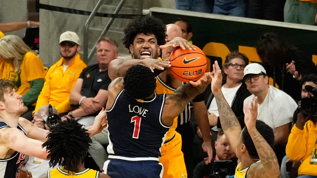 Feb 17, 2025; Waco, Texas, USA;  Arizona Wildcats guard Caleb Love (1) has his shot blocked by Baylor Bears forward Norchad Omier (15) during the second half at Paul and Alejandra Foster Pavilion. Mandatory Credit: Chris Jones-Imagn Images