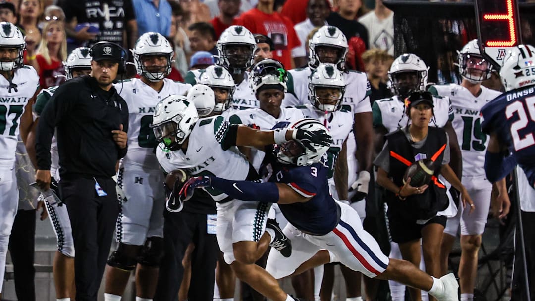 Aug 30, 2025; Tucson, Arizona, USA; Arizona Wildcats defensive lineman Tre Smith (3) tackles Hawaii Rainbow Warriors running back Cam Barfield (0) during the first quarter of the game at Arizona Stadium. Mandatory Credit: Aryanna Frank-Imagn Images