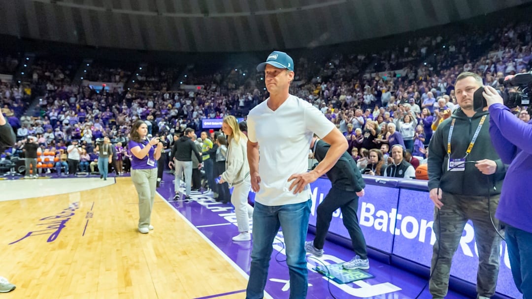 LSU Football Coach Lane Kiffin walks out with Tigers Basketball Coach Kim Mulkey, LSU Tigers Womens Basketball takes on the Kentucky Wildcats. Thursday, Jan. 1, 2026.