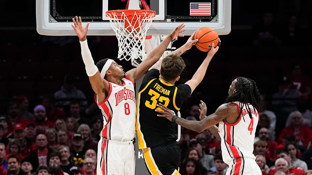 Ohio State Buckeyes guard Micah Parrish (8) defends Iowa Hawkeyes forward Owen Freeman (32) during the first half of the NCAA men's basketball game at Value City Arena on Jan. 27, 2025.
