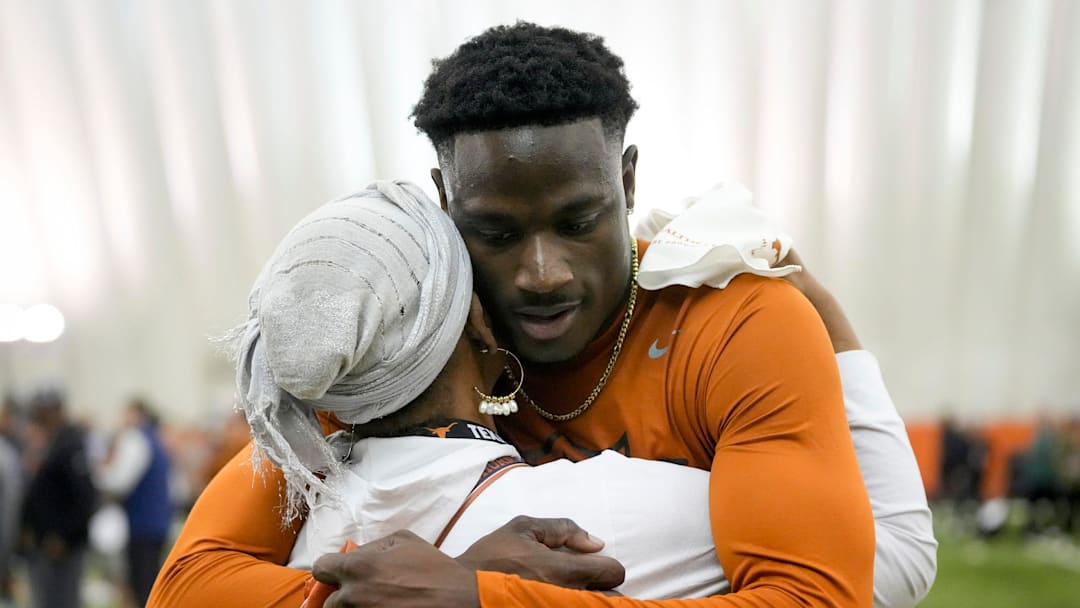 Ryan Watts hugs his mother Claire Watts-Cooper at Texas Longhorns Football Pro Day at Frank Denius Fields Wednesday March 20, 2024.