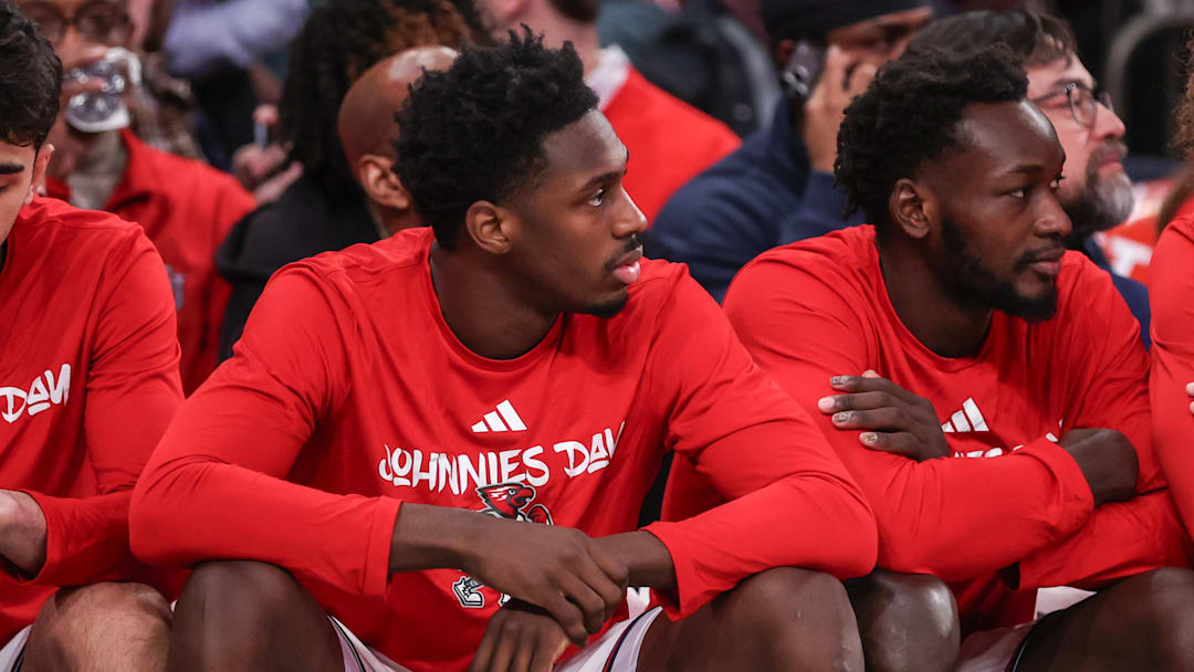 Feb 21, 2026; New York, New York, USA;  St. John's basketball guard Ian Jackson (11) watches from the bench in the second half against the Creighton Bluejays at Madison Square Garden.