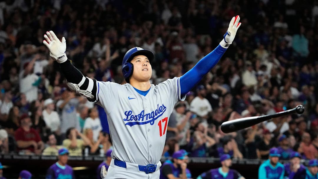 Los Angeles Dodgers Shohei Ohtani tosses his bat after hitting a three run home run against the Arizona Diamondbacks in the ninth inning at Chase Field in Phoenix on May 9, 2025. Mandatory Credit: Rob Schumacher-Arizona Republic
