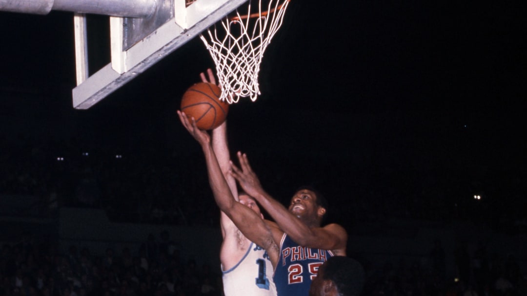 Unknown date; Los Angeles, CA, USA; FILE PHOTO; Philadelphia 76ers forward Chet Walker (25) shoots over Los Angeles Lakers center Jim Barnes (23) and Darrall Imhoff (14) at the Los Angeles Sports Arena. Mandatory Credit: Darryl Norenberg-USA TODAY Sports