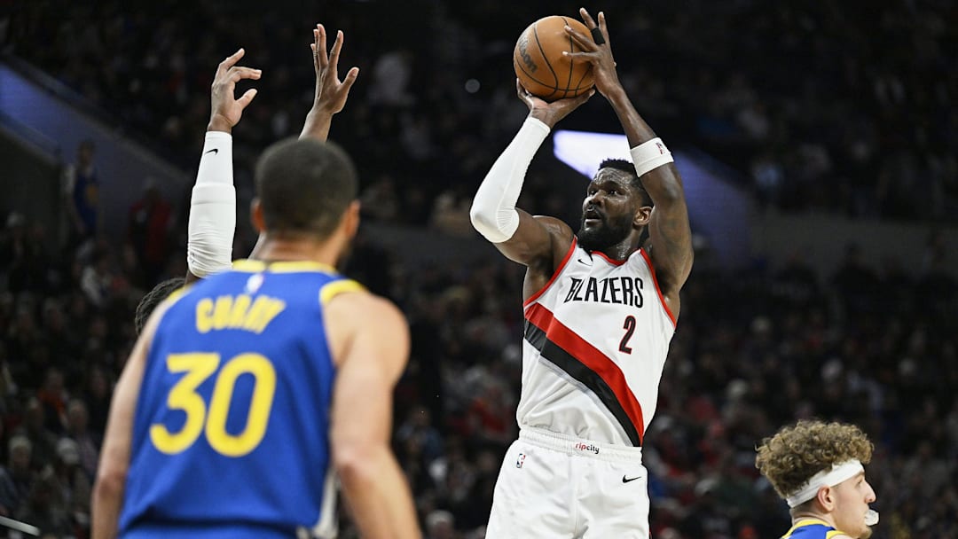 Apr 11, 2024; Portland, Oregon, USA; Portland Trail Blazers center Deandre Ayton (2) shoots a jump shot during the second half against the Golden State Warriors at Moda Center. Mandatory Credit: Troy Wayrynen-Imagn Images