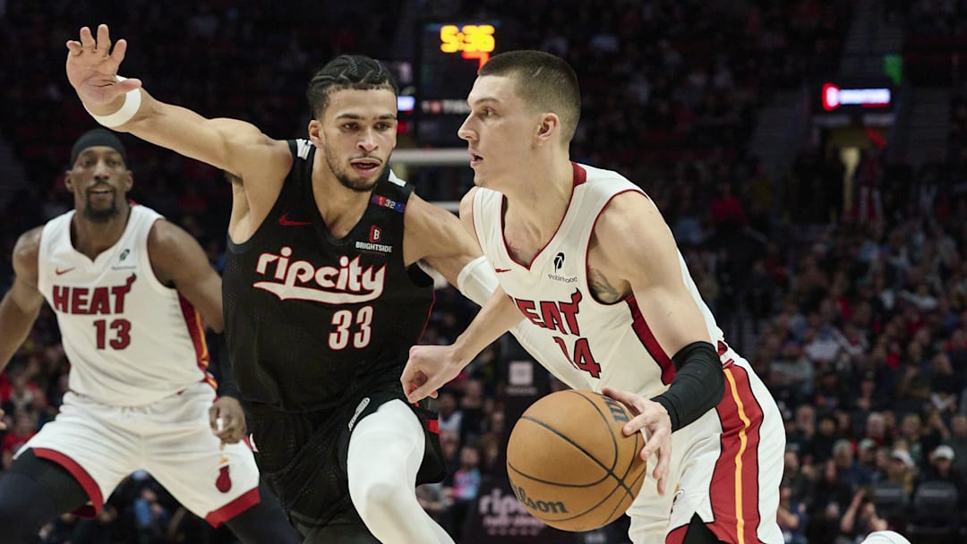 Jan 11, 2025; Portland, Oregon, USA; Miami Heat guard Tyler Herro (14) drives to the basket during the second half against Portland Trail Blazers forward Toumani Camara (33) at Moda Center. Mandatory Credit: Troy Wayrynen-Imagn Images Jan 11, 2025; Portland, Oregon, USA; Miami Heat guard Tyler Herro (14) drives to the basket during the second half against Portland Trail Blazers forward Toumani Camara (33) at Moda Center. Mandatory Credit: Troy Wayrynen-Imagn Images