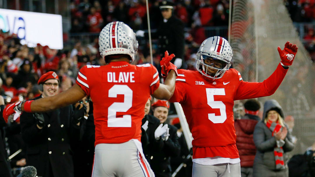 Ohio State Buckeyes wide receiver Garrett Wilson (5) celebrates a 51-yard touchdown with wide receiver Chris Olave (2) during the second quarter of the NCAA football game against the Purdue Boilermakers at Ohio Stadium in Columbus on Saturday, Nov. 13, 2021.

Purdue 2