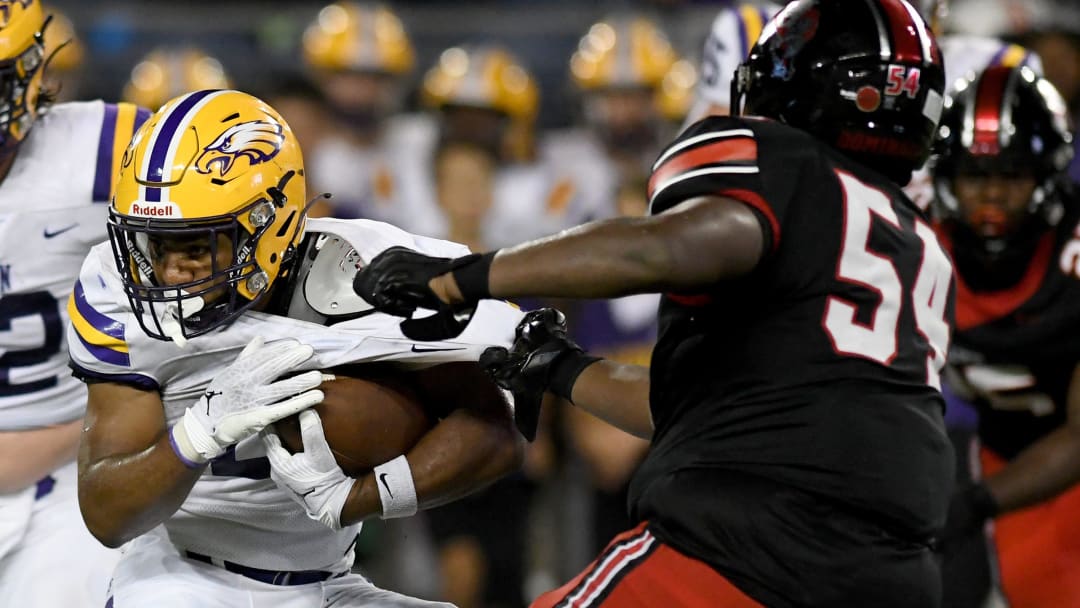 Canton McKinley's Dior Garner (54) makes a tackle against Avon during a high school football game, Friday, Aug. 25, 2023.