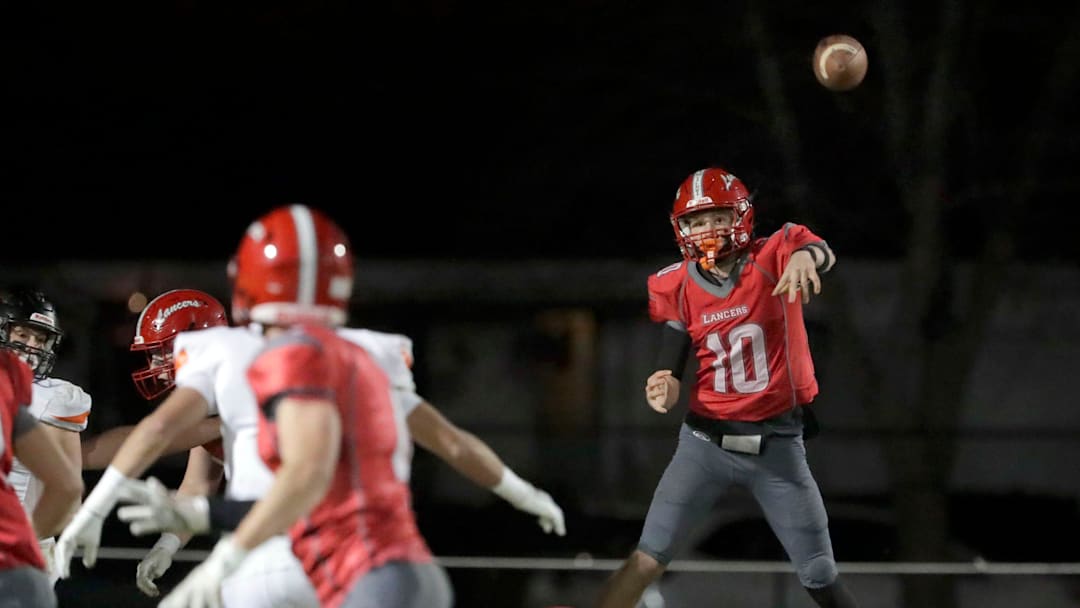 Manitowoc Lutheran's Jaymen Ott (10) passes the ball against Cedar Grove-Belgium, Friday, November 7, 2025, in Manitowoc, Wis.