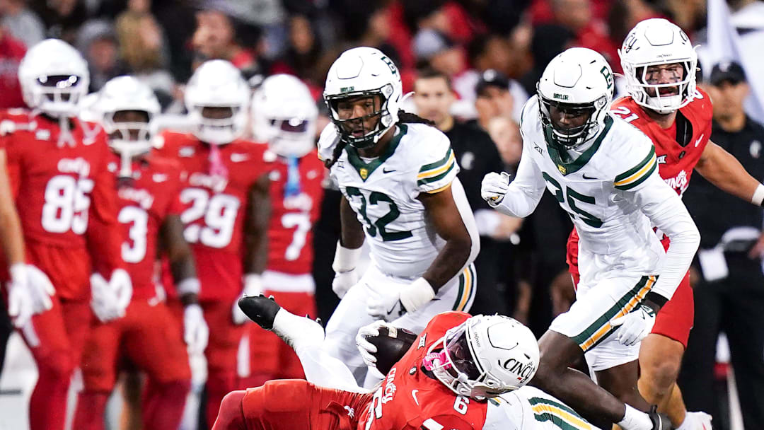 Baylor Bears linebacker Keaton Thomas (11) tackles Cincinnati Bearcats running back Evan Pryor (6) in the fourth quarter of a NCAA men’s football game between the Cincinnati Bearcats and Baylor Bears, Saturday, Oct. 25, 2025, at Nippert Stadium in Cincinnati