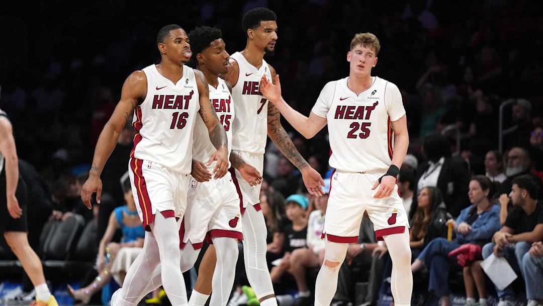 Oct 8, 2025; Miami, Florida, USA; Miami Heat guard Kasparas Jakucionis (25) is congratulated by forward Keshad Johnson (16), forward Myron Gardner (15) and center Kel'El Ware (7) during a timeout in the second half against the San Antonio Spurs at Kaseya Center. Mandatory Credit: Jim Rassol-Imagn Images Oct 8, 2025; Miami, Florida, USA; Miami Heat guard Kasparas Jakucionis (25) is congratulated by forward Keshad Johnson (16), forward Myron Gardner (15) and center Kel'El Ware (7) during a timeout in the second half against the San Antonio Spurs at Kaseya Center. Mandatory Credit: Jim Rassol-Imagn Images