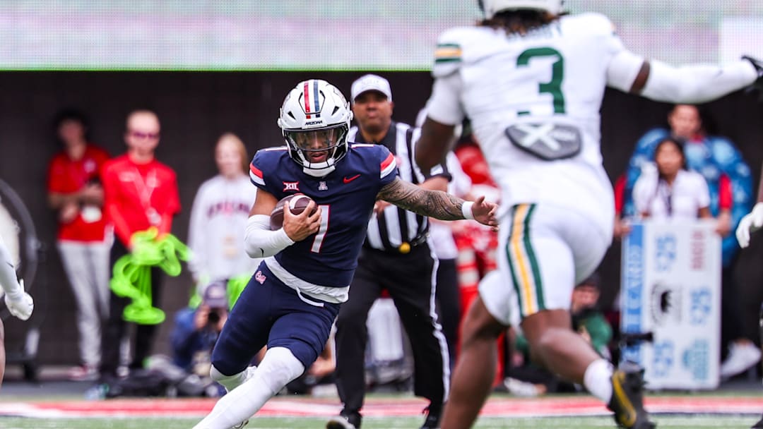 Nov 22, 2025; Tucson, Arizona, USA; Arizona Wildcats quarterback Noah Fifita (1) runs with the ball during the third quarter of the game against the Baylor Bears at Casino Del Sol Stadium. Mandatory Credit: Aryanna Frank-Imagn Images