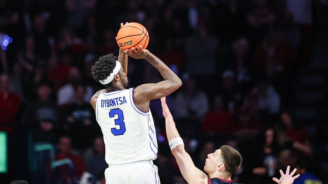 Feb 18, 2026; Tucson, Arizona, USA; Brigham Young Cougars forward AJ Dybantsa (3) makes a three pointer over Arizona Wildcats forward Ivan Kharchenkov (8) during the second half of the game at McKale Memorial Center. Mandatory Credit: Aryanna Frank-Imagn Images Feb 18, 2026; Tucson, Arizona, USA; Brigham Young Cougars forward AJ Dybantsa (3) makes a three pointer over Arizona Wildcats forward Ivan Kharchenkov (8) during the second half of the game at McKale Memorial Center. Mandatory Credit: Aryanna Frank-Imagn Images