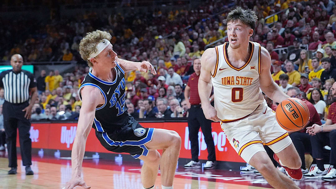 Iowa State Cyclones guard Nate Heise (0) drives with the ball around BYU Cougars's forward Richie Saunders (15) during the second over-time of the Big-12 men’s basketball in the Senior Day at Hilton Coliseum on March 4, 2025, in Ames, Iowa.