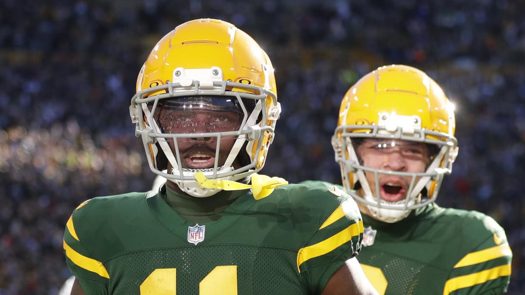 Packers receivers Jayden Reed and Christian Watson celebrate a touchdown by Reed vs. the Chargers.