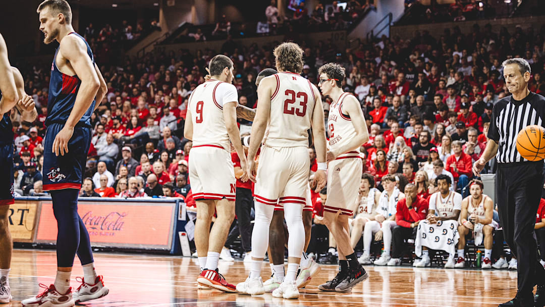 Nebraska men's basketball players huddle during their game against Saint Mary's at the Sanford Pentagon in Sioux Falls, South Dakota.