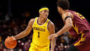 Dec 1, 2024; Minneapolis, Minnesota, USA; Minnesota Golden Gophers guard Isaac Asuma (1) dribbles as Bethune-Cookman Wildcats forward Daniel Rouzan (23) defends during the first half at Williams Arena. Mandatory Credit: Matt Krohn-Imagn Images