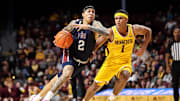 Dec 21, 2024; Minneapolis, Minnesota, USA; Fairleigh Dickinson Knights guard Terrence Brown (2) works around Minnesota Golden Gophers guard Isaac Asuma (1) during the second half at Williams Arena. Mandatory Credit: Matt Krohn-Imagn Images