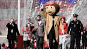 Nov 18, 2023; Columbus, Ohio, USA; Ohio State Buckeyes head coach Ryan Day walks into Ohio Stadium behind Brutus Buckeye prior to the NCAA football game against the Minnesota Golden Gophers.