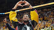 Former Iowa State and Indiana Packer guard Tyrese Haliburton shows heart sign as the unveiling his Olympic 24 gold made banner during the halftime of Cyclones and Wildcats men’s basketball showdown at Hilton Coliseum on Saturday March 1, 2025 in Ames, Iowa.