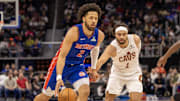 Feb 5, 2025; Detroit, Michigan, USA; Detroit Pistons guard Cade Cunningham (2) moves the ball up court next to Cleveland Cavaliers guard Max Strus (1) during the first half at Little Caesars Arena. Mandatory Credit: David Reginek-Imagn Images
