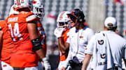 Oct 4, 2025; Tucson, Arizona, USA; Oklahoma State Cowboys interim head coach Doug Meacham talks to players during a timeout that took place during the third quarter of the game against the Arizona Wildcats at Arizona Stadium. Mandatory Credit: Aryanna Frank-Imagn Images