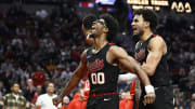 Apr 12, 2024; Portland, Oregon, USA; Portland Trail Blazers guard Scoot Henderson (00) reacts with teammate forward Justin Minaya (24) after dunking the basketball during the second half against the Houston Rockets at Moda Center. Mandatory Credit: Troy Wayrynen-USA TODAY Sports