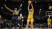 Apr 1, 2024; Portland, OR, USA; USC Trojans guard JuJu Watkins (12) shoots a jump shot during the second half against UConn Huskies forward Aaliyah Edwards (3) in the finals of the Portland Regional of the NCAA Tournament at the Moda Center. Mandatory Credit: Troy Wayrynen-Imagn Images