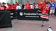 May 25, 2012; Newark, NJ, USA; A young fan hits a New York Rangers logo before game six of the 2012 Eastern Conference Finals at the Prudential Center.  Mandatory Credit: Ed Mulholland-Imagn Images
