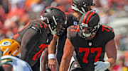 Cleveland Browns guard Wyatt Teller (77) has a word with offensive tackle KT Leveston (72) before a play during the first half of an NFL football game at Huntington Bank Field, Sept. 21, 2025, in Cleveland, Ohio.
