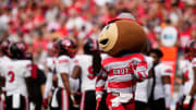 Sep 16, 2023; Columbus, Ohio, USA; Brutus Buckeye races an Ohio State student across the field during the first half of the NCAA football game against the Western Kentucky Hilltoppers at Ohio Stadium.