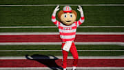 Ohio State Buckeyes mascot Brutus leads the marching band onto the field prior to the NCAA football game against the Michigan Wolverines at Ohio Stadium in Columbus on Tuesday, Dec. 3, 2024.