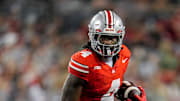 Ohio State Buckeyes wide receiver Jeremiah Smith (4) runs an end around for a touchdown during the NCAA football game against the Ohio Bobcats at Ohio Stadium on Sept. 13, 2025. Ohio State won 37-9.