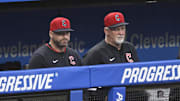 Sep 10, 2025; Cleveland, Ohio, USA; Cleveland Guardians manager Stephen Vogt (12) and pitching coach Carl Willis (51) look on from the dugout in the fourth inning against the Kansas City Royals at Progressive Field. Mandatory Credit: David Richard-Imagn Images