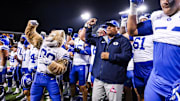 Brigham Young Cougars head coach Kalani Sitake celebrates a win against the Arizona Wildcats after overtime with his team and the crowd at Arizona Stadium. Credit: Aryanna Frank-Imagn Images