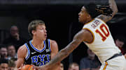 Iowa State Cyclones guard Keshon Gilbert (10) tries to nocks the ball out from BYU Cougars's guard Dallin Hall (30) during the first half of the Big-12 men’s basketball in the Senior Day at Hilton Coliseum on March 4, 2025, in Ames, Iowa.